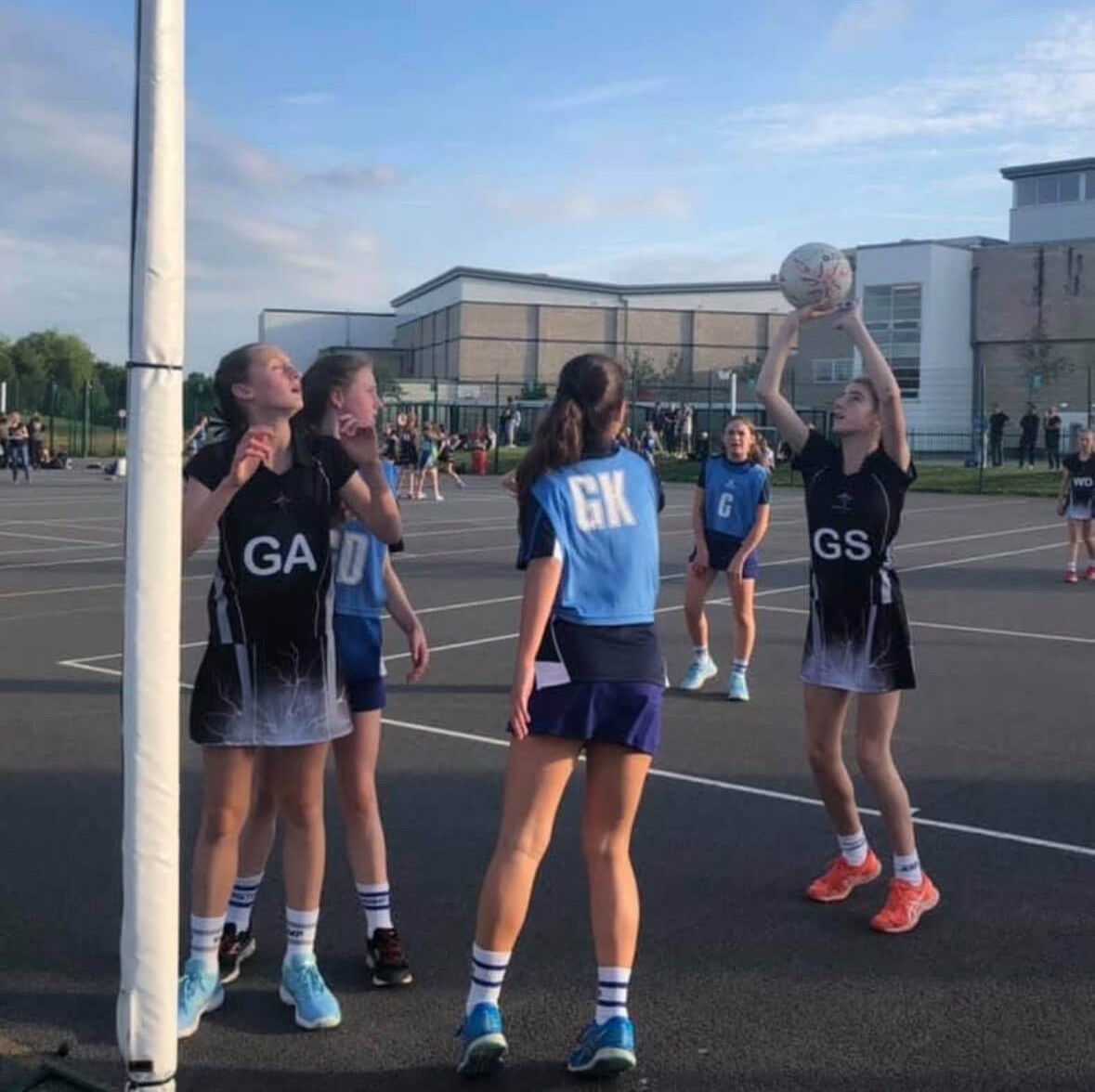 Netball competition outdoors.